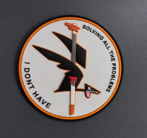 Military patch with a stylized black bird and phrase about not having a nine.