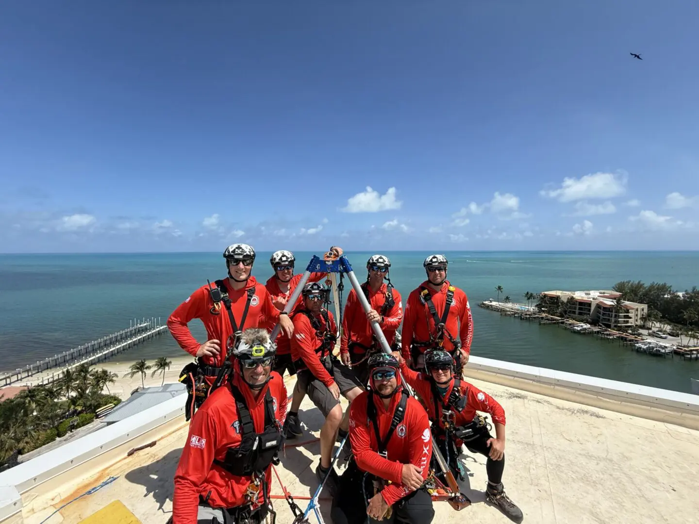 Rooftop rescue team in red overlooking ocean